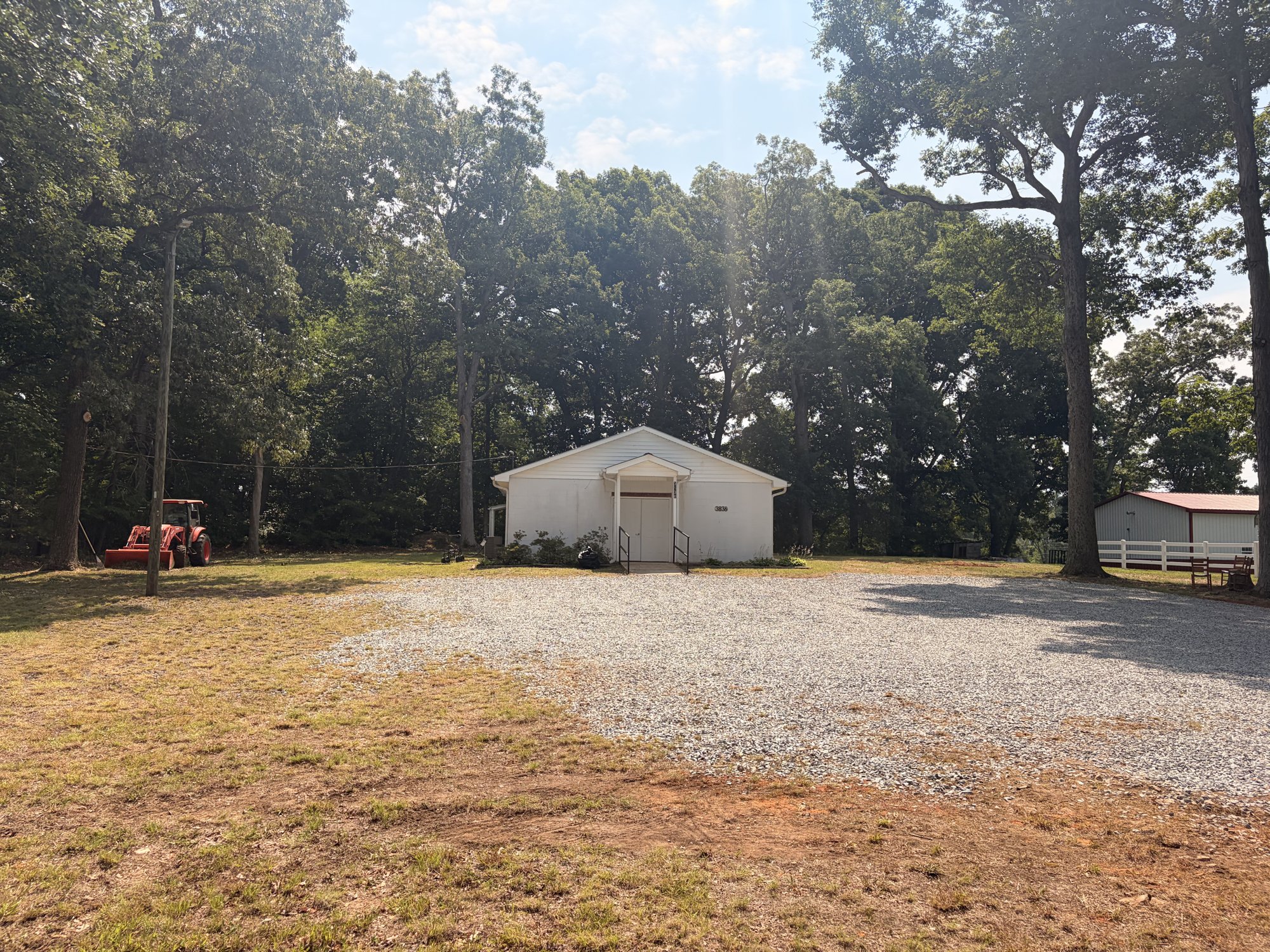 Windy Hill Baptist Church building surrounded by trees