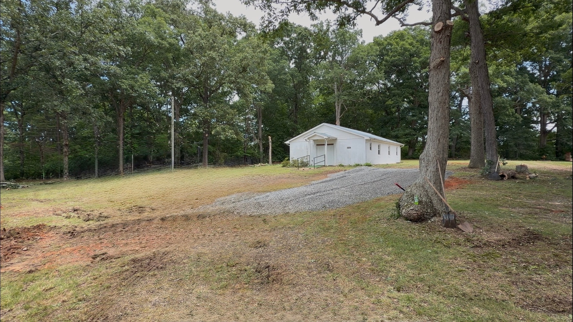 Windy Hill Baptist Church building surrounded by trees